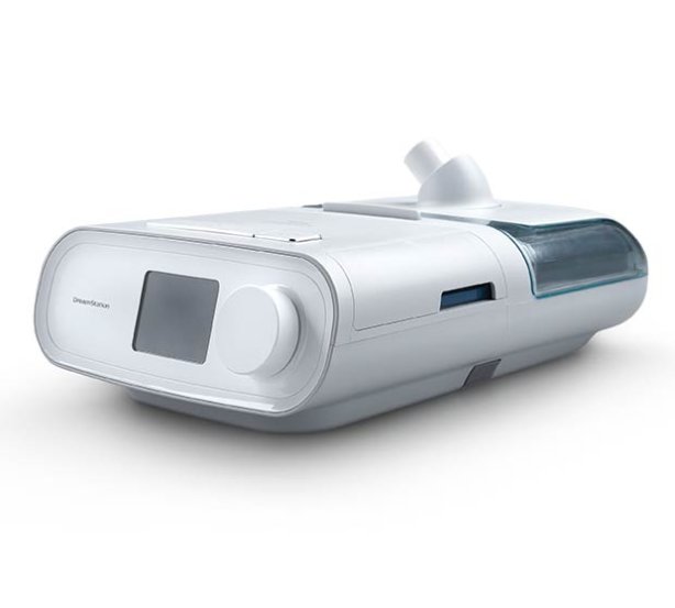 Das elegante und diskrete Schlaftherapiegerät Philips DreamStation (Hersteller Philips), vertrieben von PMT Medizintechnik GmbH, zeigt sein kompaktes, weißes Design mit Display und Bedienelementen.